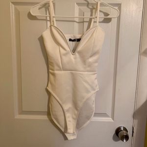 Low cut white bodysuit